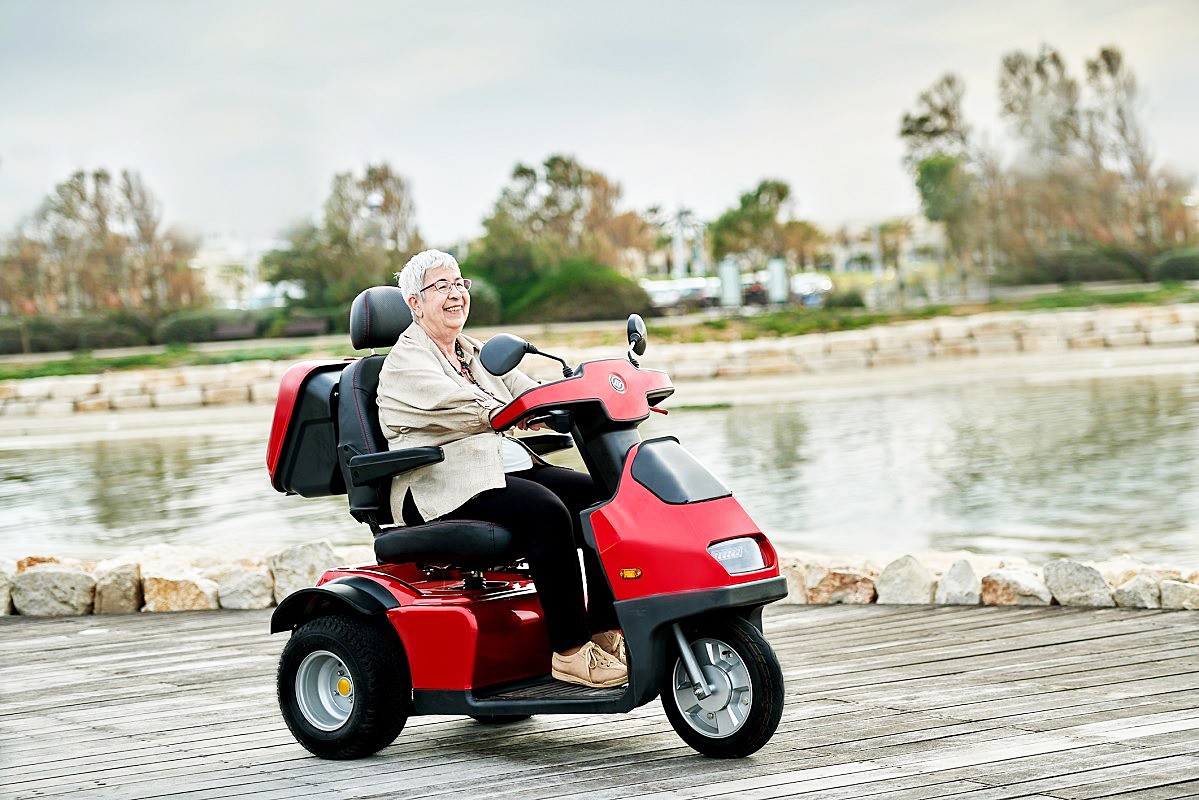 Woman Out for a Ride in Her 3 Wheel Recreational Mobility Scooter