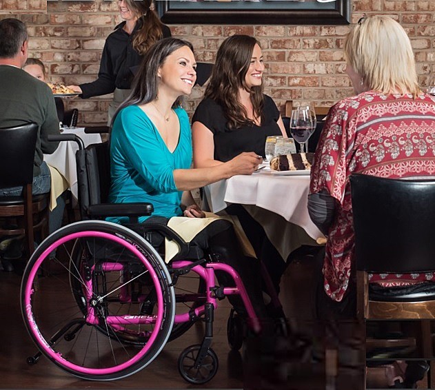 Standard Lightweight Manual Wheelchair User Enjoying Time With Friends