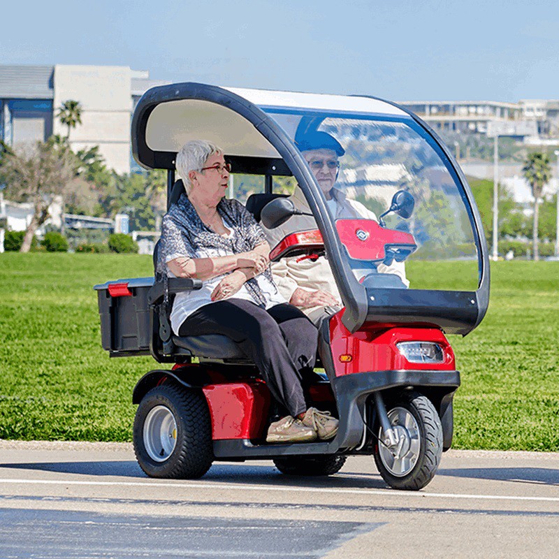 Couple Out and About in Their 3 Wheel Canopy Recreational Scooter