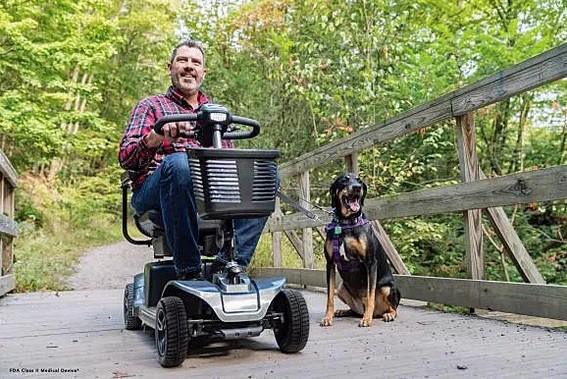 Revo 2.0 4-Wheel Scooter - Man With Best Friend Enjoying the Outdoors