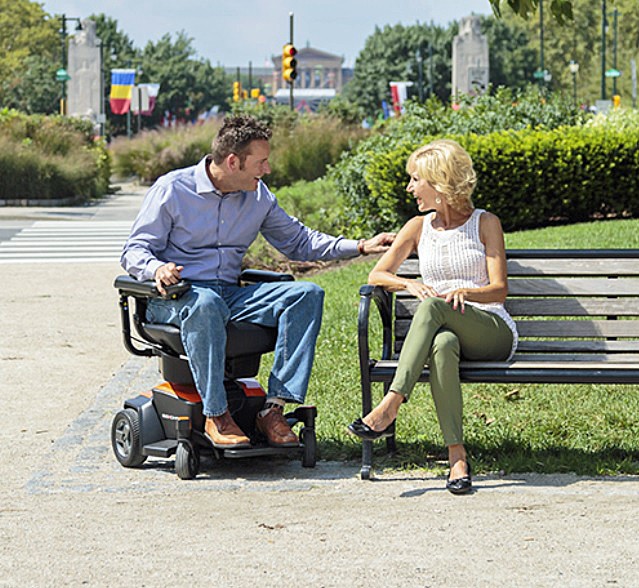 Rider Enjoying Conversation on a Travel/ Portable Power Chair Wheelchair