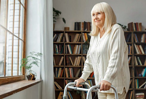 Woman Using a Standard Walker Enjoying the Outside View