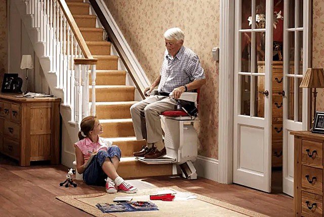 Straight Rail Indoor Stair Lift User with Granddaughter