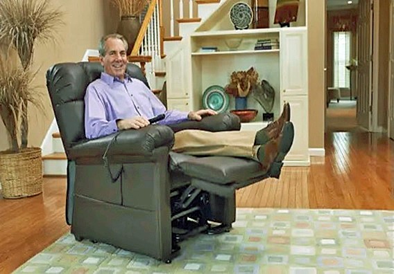 Man sitting and relaxing on a lift chair