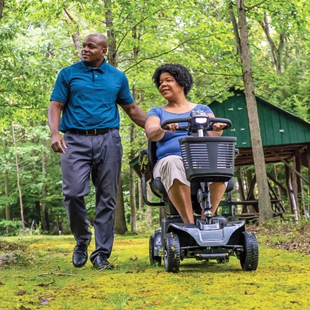 Revo 2.0 4-Wheel Scooter - Couple Taking Pleasure With a Scenic Ride Through the Park